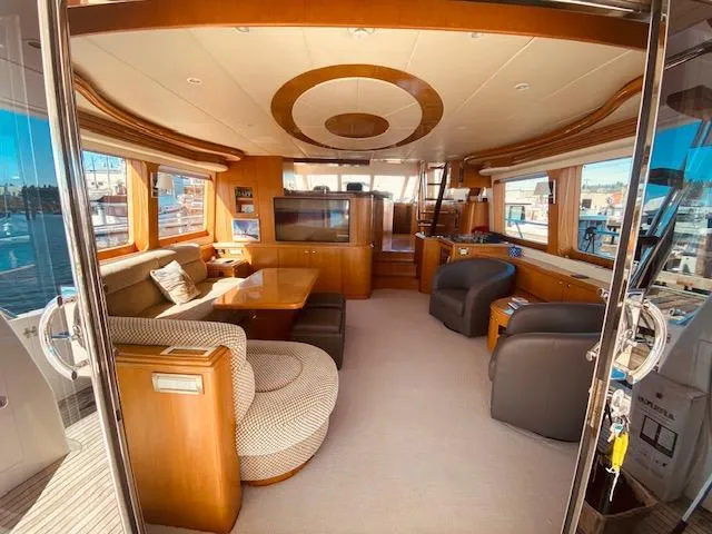 Slide: The Image of Luxurious interior of 2007 Regency Yachts 670 Pilothouse with elegant seating and large windows. - 7