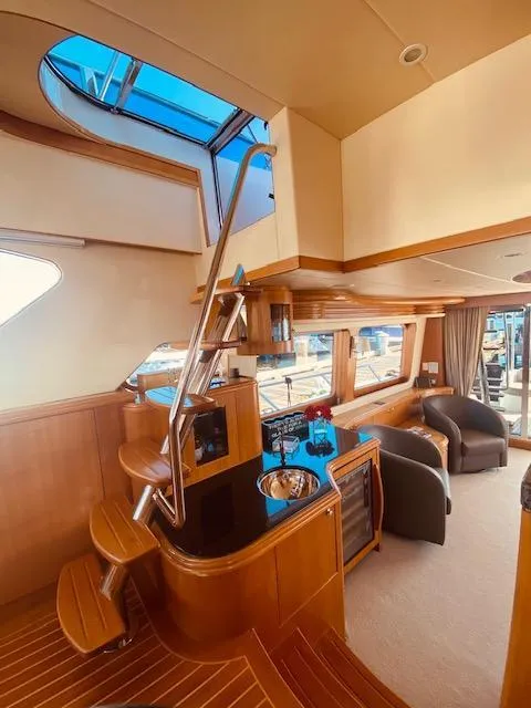 Slide: The Image of 2007 Regency Yachts 670 Pilothouse interior with modern design and wooden finishes. - 8