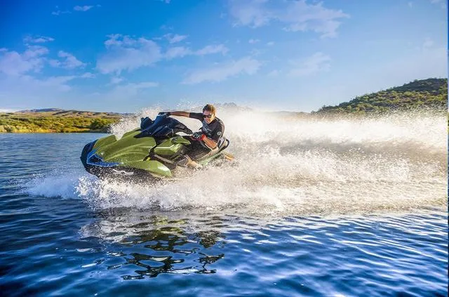 Slide: The Image of 2024 Kawasaki Waverunner JET SKI® ULTRA® 310LX speeding on a lake. - 6