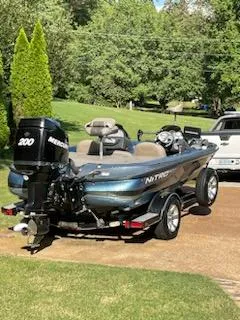 Slide: The Image of 2006 Nitro 901 CDX DC boat on trailer in sunny driveway. - 3