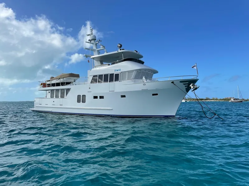 Slide: The Image of 2017 Northern Marine Expedition yacht anchored in clear blue ocean waters. - 12