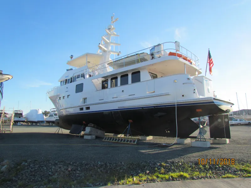 Slide: The Image of 2017 Northern Marine Expedition yacht on dry dock with American flag. - 13