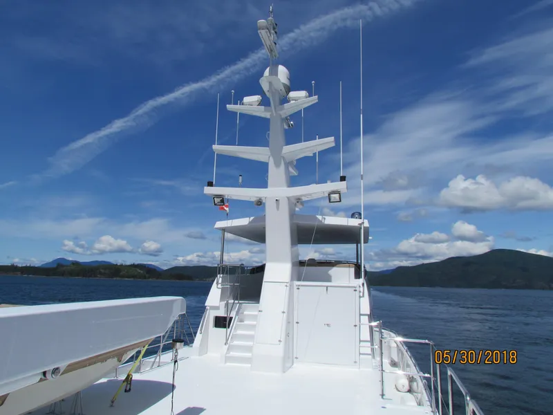 Slide: The Image of 2017 Northern Marine Expedition yacht on open water under clear blue sky. - 16