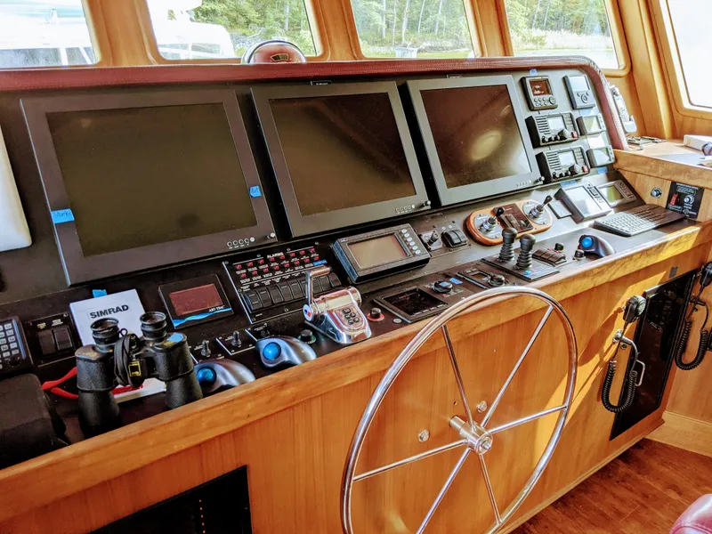 Slide: The Image of 2017 Northern Marine Expedition yacht helm with advanced navigation systems and controls. - 23
