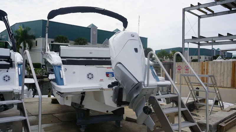 Slide: The Image of 2024 Cobalt R4 boat with outboard motor in marina. - 11