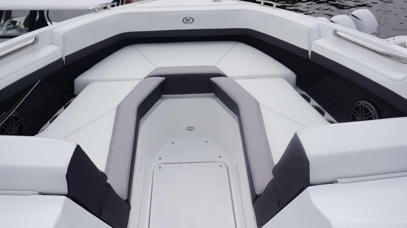 Slide: The Image of 2024 Cobalt R4 boat interior with white and gray seating. - 13