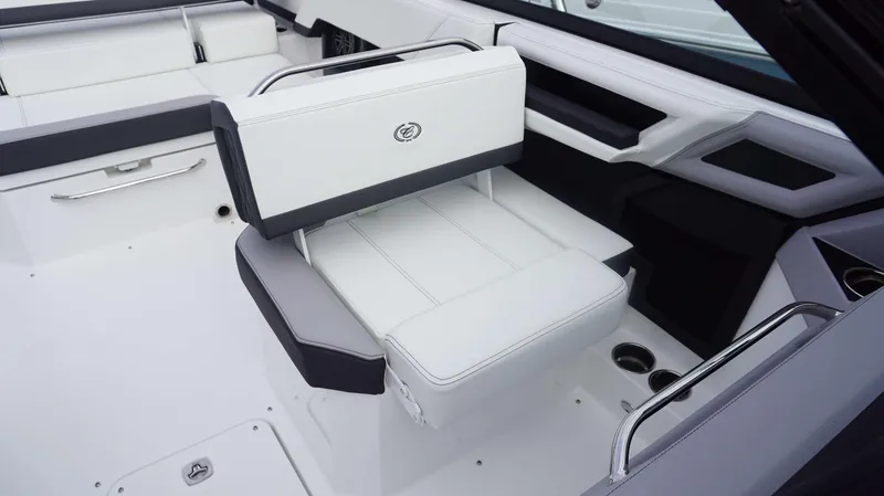 Slide: The Image of 2024 Cobalt R4 boat interior with white and gray seating. - 16