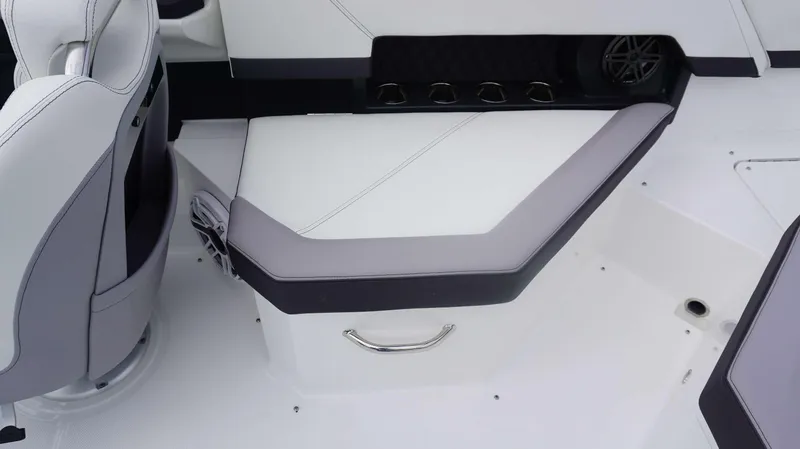 Slide: The Image of Interior seating of 2024 Cobalt R4 boat with cup holders and speaker. - 18