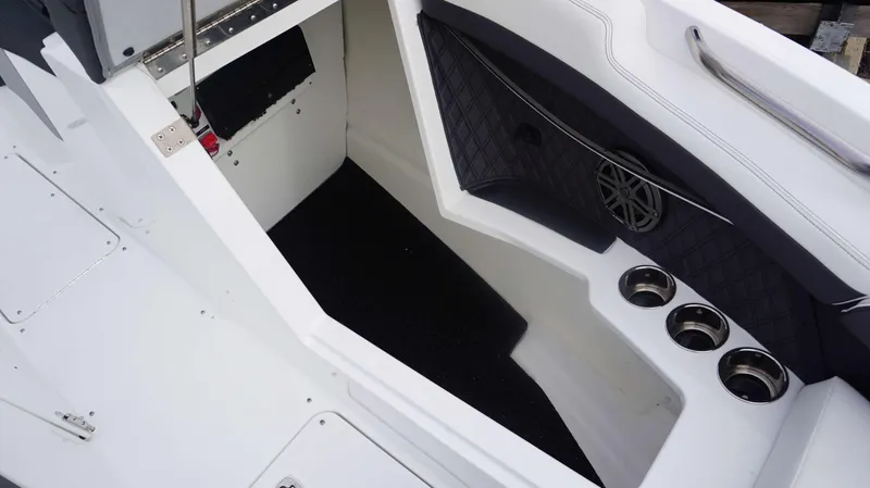 Slide: The Image of Interior of 2024 Cobalt R4 boat with cup holders and speaker. - 9