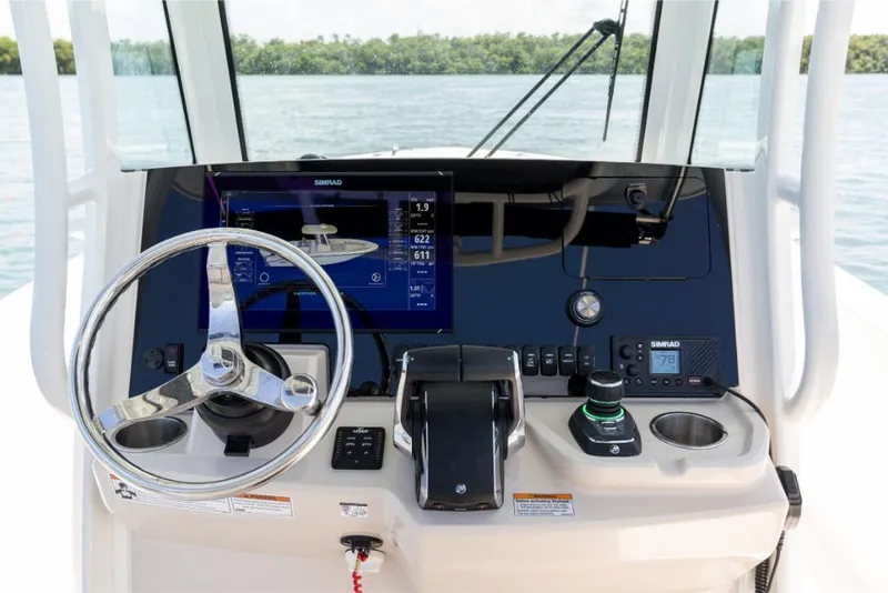 Slide: The Image of 2024 Boston Whaler 280 Dauntless helm with advanced navigation system and controls. - 31