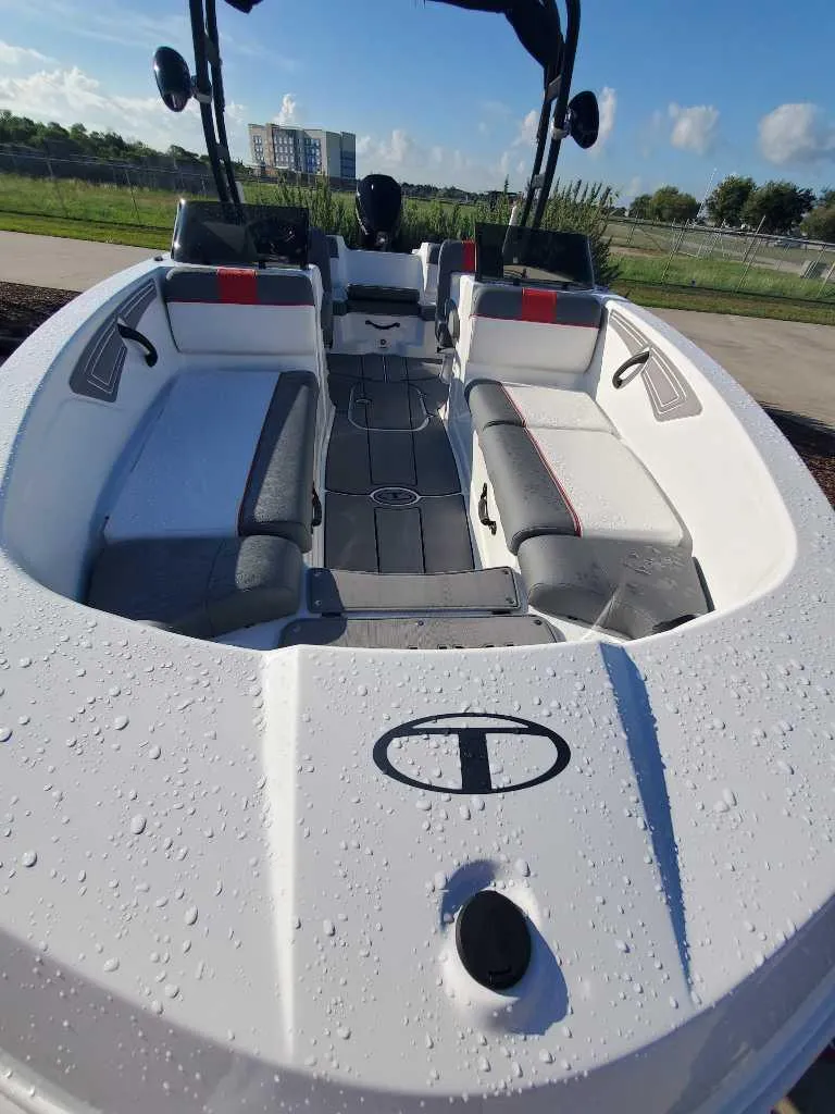 Slide: The Image of 2024 Tahoe T21 boat interior with seating and wet deck. - 7