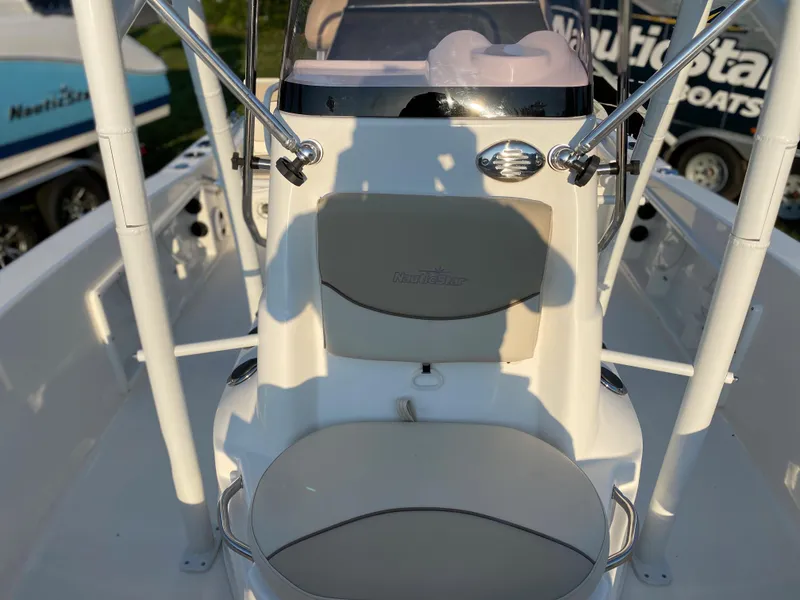 Slide: The Image of 2022 NauticStar 191 Hybrid boat interior with seating and console. - 11