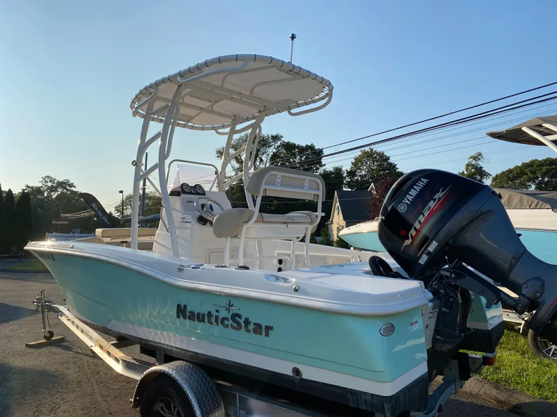 Slide: The Image of 2022 NauticStar 191 Hybrid boat with Yamaha outboard motor on trailer. - 3