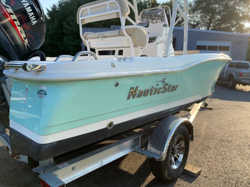 Slide: The Image of 2022 NauticStar 191 Hybrid boat on trailer, side view. - 6
