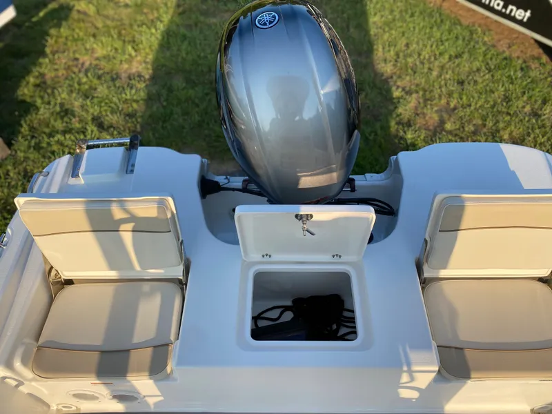 Slide: The Image of 2022 NauticStar 191 Hybrid boat with outboard motor and seating. - 9