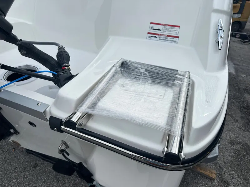 Slide: The Image of 2025 Bayliner Element M15 boat with wrapped swim ladder on deck. - 6