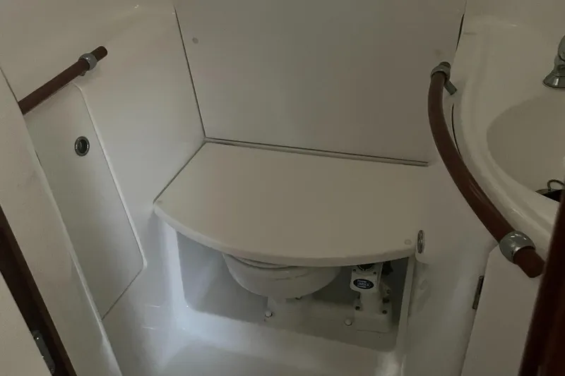 Slide: The Image of 2002 Beneteau 393 yacht bathroom with toilet and sink - 18