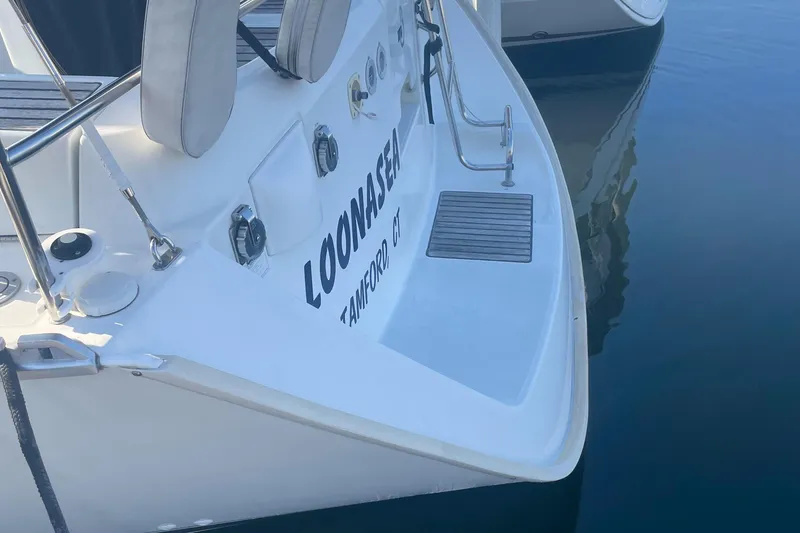 Slide: The Image of 2002 Beneteau 393 sailboat named Loonasea docked in calm waters. - 8