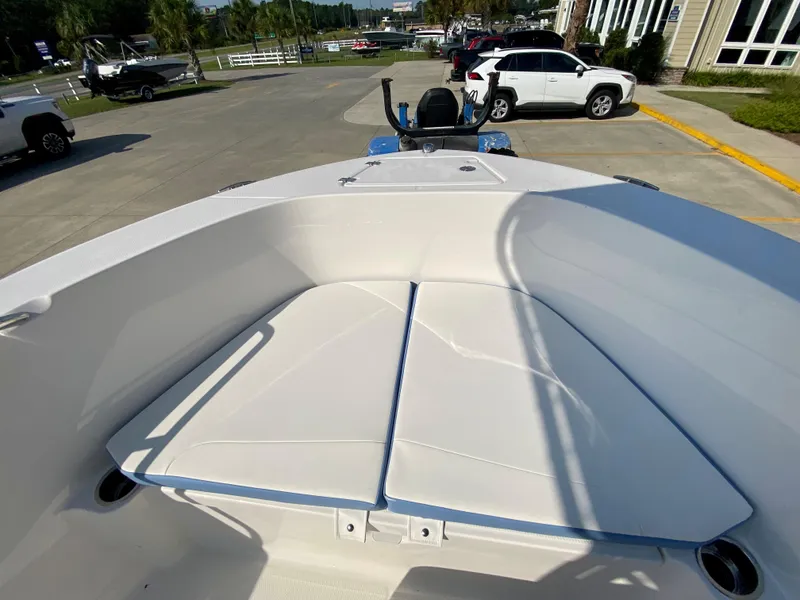 Slide: The Image of 2024 Robalo R180 Center Console boat with cushioned bow seating. - 15