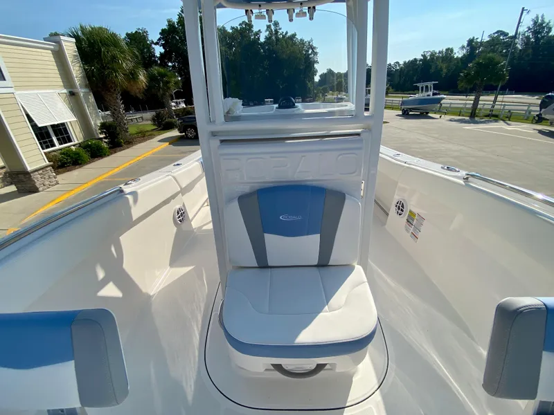 Slide: The Image of 2024 Robalo R232 Explorer boat interior with seating and console. - 20