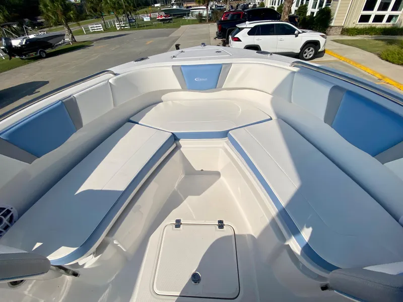 Slide: The Image of 2024 Robalo R232 Explorer boat interior with spacious seating and storage. - 22
