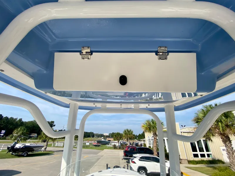 Slide: The Image of 2024 Robalo R232 Explorer boat T-top with storage compartment. - 17