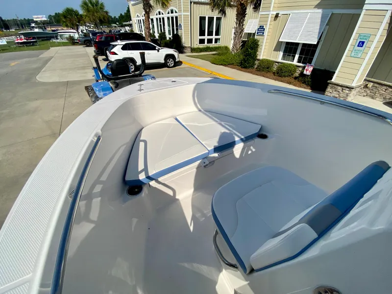 Slide: The Image of 2024 Robalo R180 Center Console boat interior with seating and storage. - 12