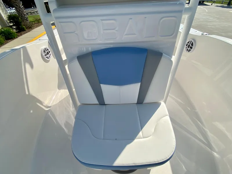 Slide: The Image of 2024 Robalo R180 Center Console boat seat with blue and white upholstery. - 13