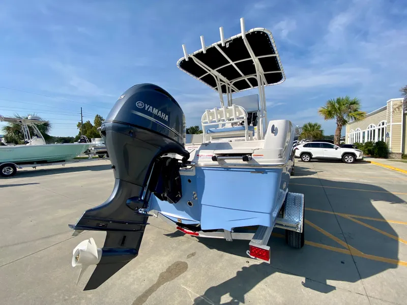 Slide: The Image of 2024 Robalo R180 Center Console boat with Yamaha outboard motor. - 2