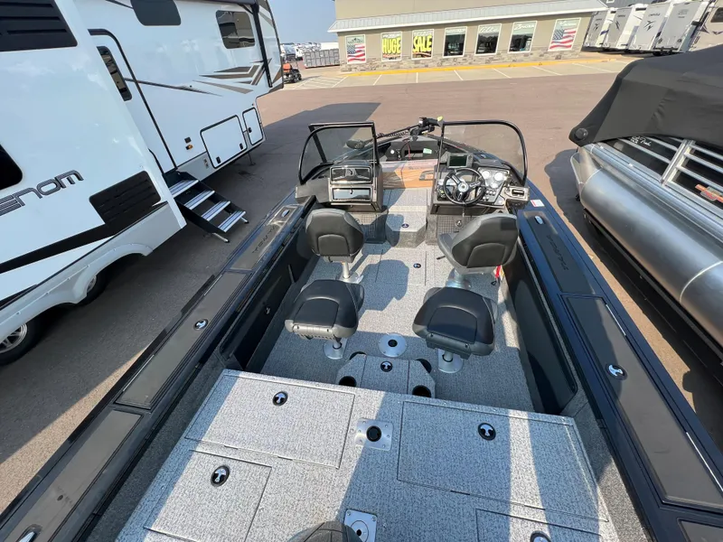 Slide: The Image of 2024 Tracker Targa V19 boat interior with dual seats and control console. - 13