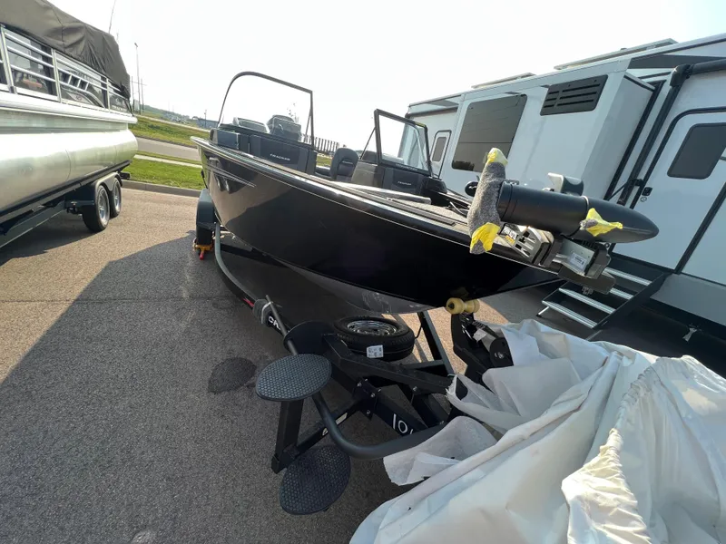 Slide: The Image of 2024 Tracker Targa V19 boat on trailer in outdoor lot. - 2