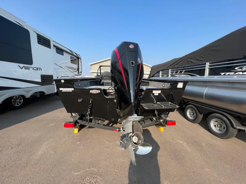 Slide: The Image of 2024 Tracker Targa V19 boat rear view with outboard motor. - 3