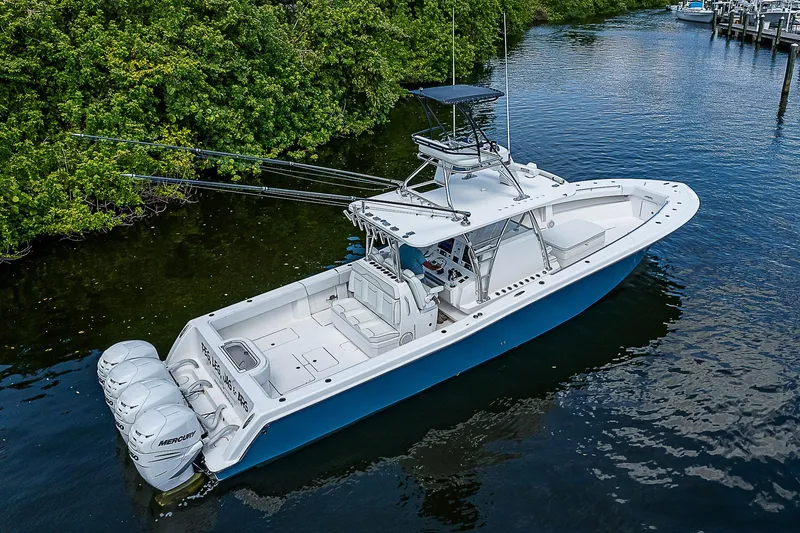 Slide: The Image of 2018 Invincible 42 boat with triple Mercury engines on calm water. - 7