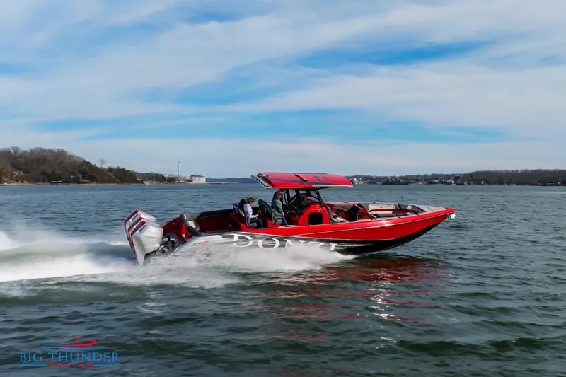 Slide: The Image of 2024 Donzi 39 VRZ speedboat cruising on a lake. - 12