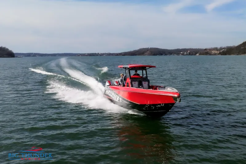 Slide: The Image of 2024 Donzi 39 VRZ speedboat cruising on a lake. - 13