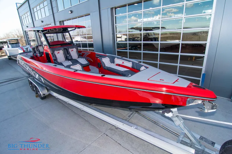 Slide: The Image of 2024 Donzi 39 VRZ boat in vibrant red, displayed at Big Thunder Marine. - 19