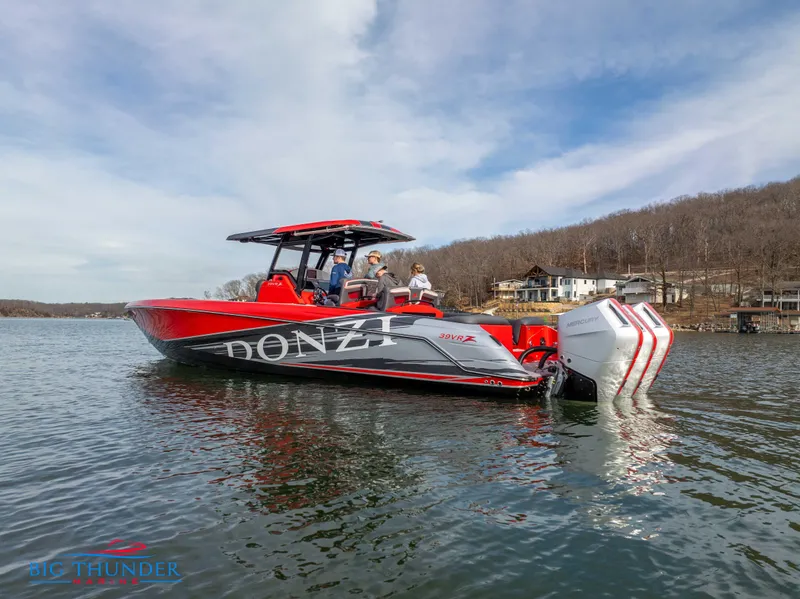 Slide: The Image of 2024 Donzi 39 VRZ boat on a lake with people onboard. - 4