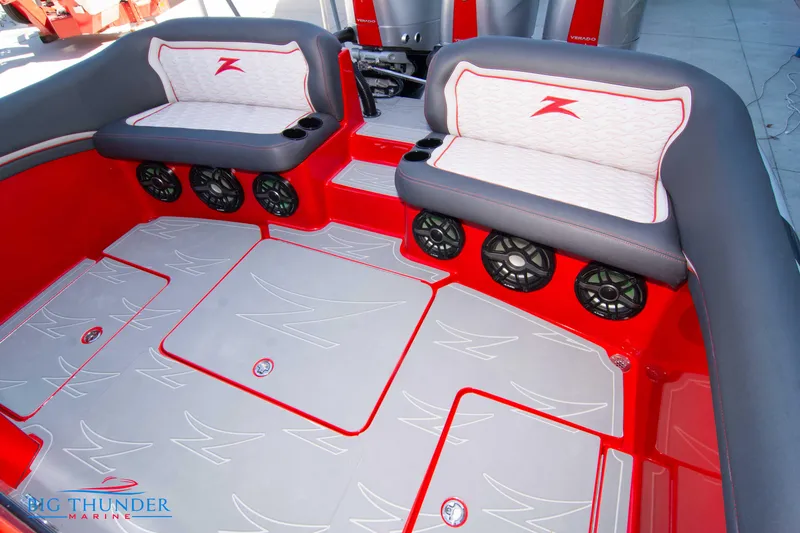 Slide: The Image of 2024 Donzi 39 VRZ boat interior with red and gray seating and multiple speakers. - 41