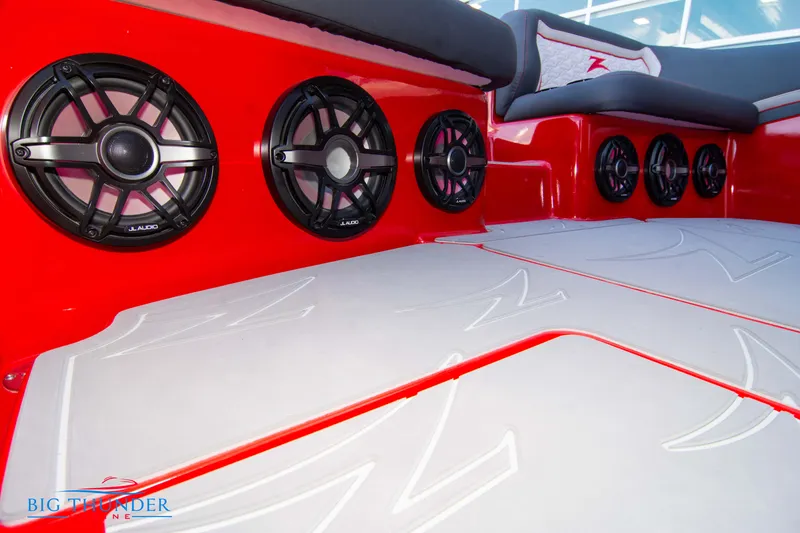 Slide: The Image of 2024 Donzi 39 VRZ boat interior with red accents and JL Audio speakers. - 42