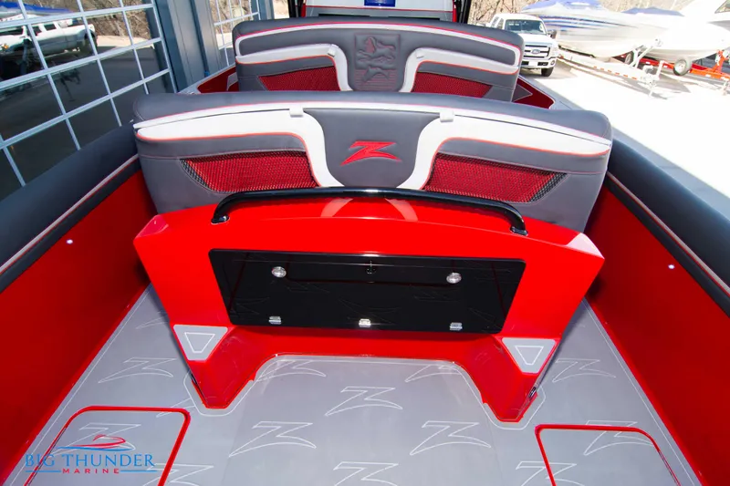 Slide: The Image of 2024 Donzi 39 VRZ boat interior with red and gray seating and flooring. - 44