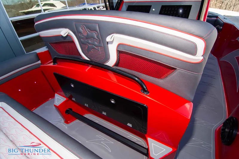 Slide: The Image of 2024 Donzi 39 VRZ boat interior with red and gray seating, Big Thunder Marine logo. - 47