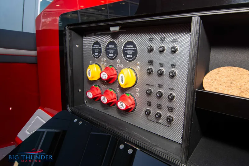 Slide: The Image of Control panel of 2024 Donzi 39 VRZ boat with switches and gauges. - 49