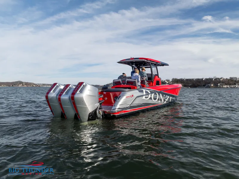 Slide: The Image of 2024 Donzi 39 VRZ boat on water with triple outboard engines. - 9