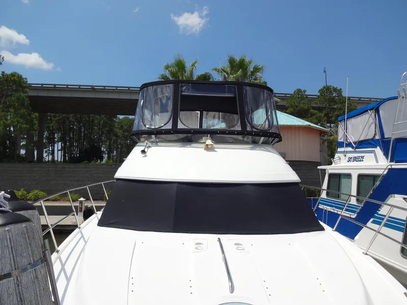 Slide: The Image of 2004 Meridian 408 Motoryacht docked at marina under clear blue sky. - 16