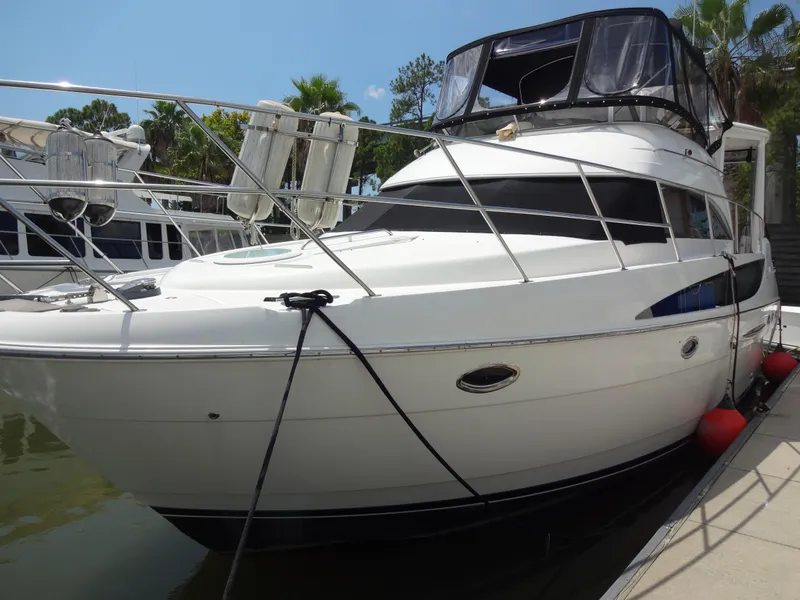 Slide: The Image of 2004 Meridian 408 Motoryacht docked at marina. - 2