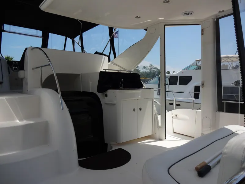 Slide: The Image of Interior view of 2004 Meridian 408 Motoryacht with white seating and steps. - 20