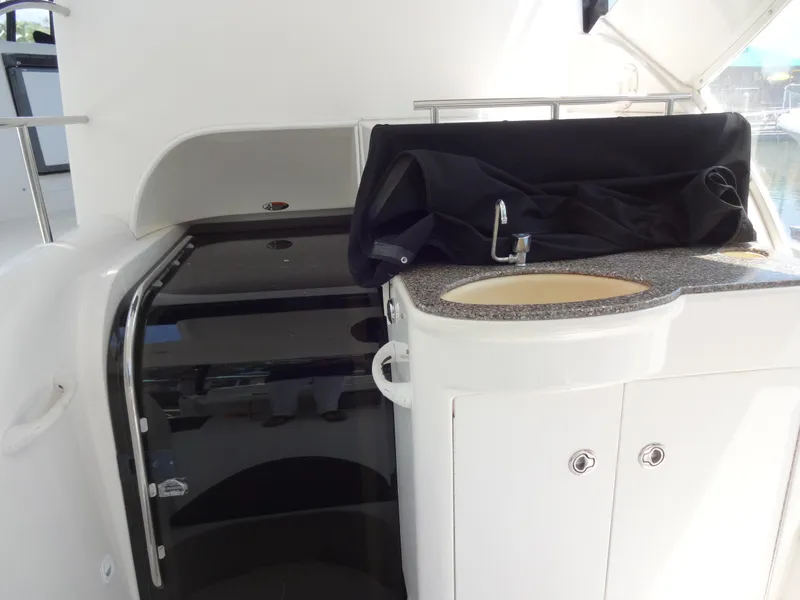 Slide: The Image of 2004 Meridian 408 Motoryacht interior with sink and storage cabinet. - 22
