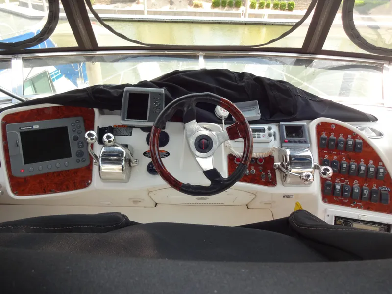 Slide: The Image of 2004 Meridian 408 Motoryacht helm with navigation equipment and controls. - 26