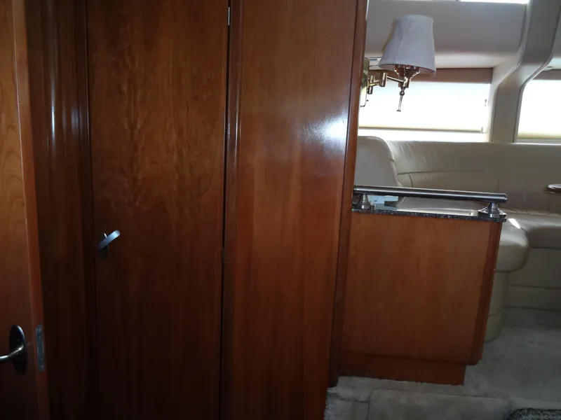 Slide: The Image of Interior of 2004 Meridian 408 Motoryacht with wooden cabinetry and beige seating. - 38