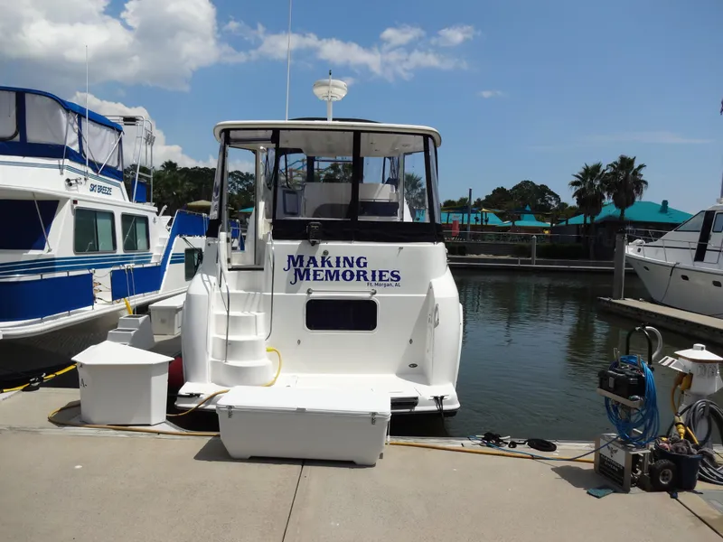 Slide: The Image of 2004 Meridian 408 Motoryacht docked at marina, named Making Memories. - 4